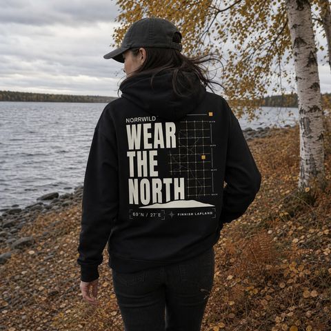 Wear the North Hoodie, worn on a trail in the northern forest
